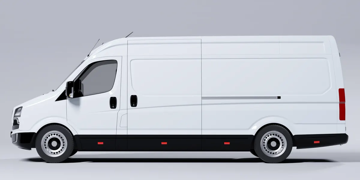 Grand fourgon utilitaire blanc vu de profil